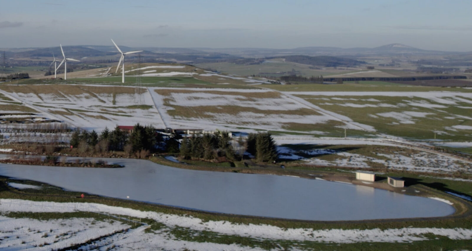 Greenmyres in winter with community wind turbines