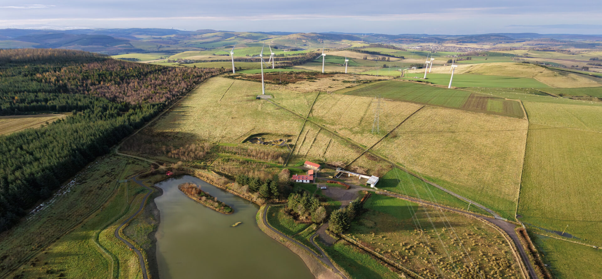 Aerial view across Greenmyres, woodland and surrounding farmland